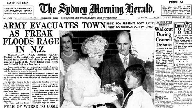 The front page of the Sydney Morning Herald on February 25, 1958 shows the late Queen Mother receiving flowers from 10-year-old Dennis Ferguson.