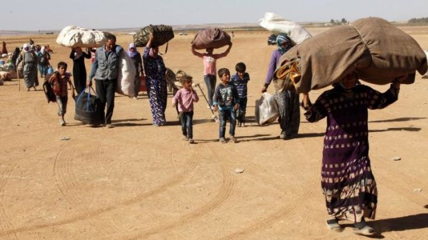 Exodus: The UN estimates there are only about 700 civilians left in Kobane.