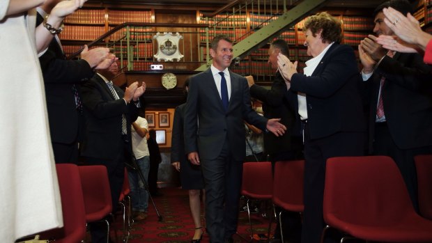 NSW Premier Mike Baird is congratulated after newly elected MPs were introduced. 