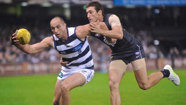 Geelong's James Podsiadly competes for the ball with Carlton's Michael Jamison.