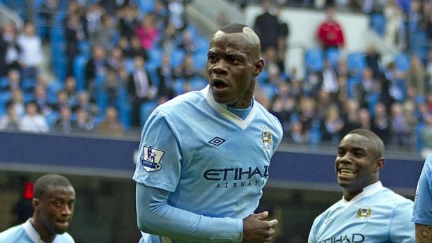 Top five: Mario Balotelli celebrates in his way after scoring the opening goal for Manchester City against Aston Villa.