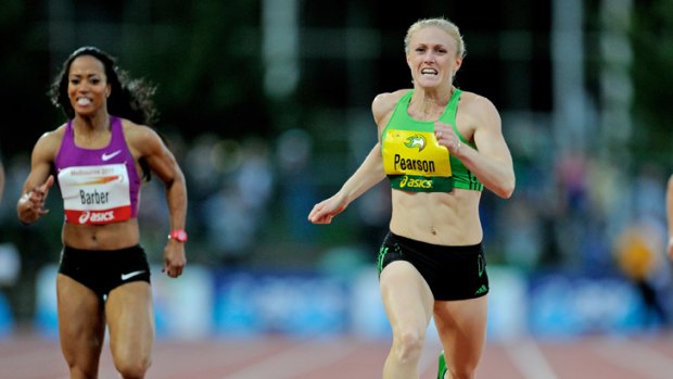 In front: Sally Pearson (right) storms to victory over Mikele Barber in the 200metres last night.