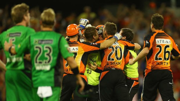 Agony and ecstasy: James Faulkner and Shane Warne of the Stars look on as the Scorchers celebrate their win.