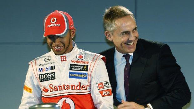 Lewis Hamilton jokes with McLaren team leader Martin Whitmarsh during the launch of the McLaren Mercedes Formula One car for the 2012 season in Woking, England. A Munich court wanted Hamilton to give evidence in Adrian Sutil's trial.