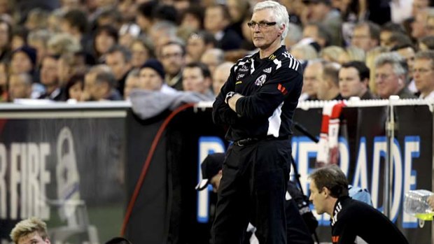 Mick Malthouse looks on as his team is thrashed by the Cats.
