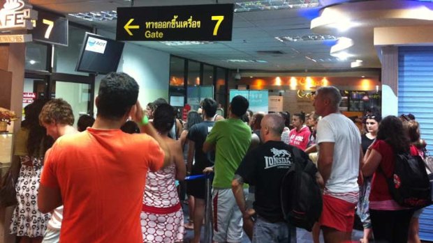 Bewildered passengers wait in vain to board their flight at Phuket. Photo: theage.com.au reader Yves Makhoul.