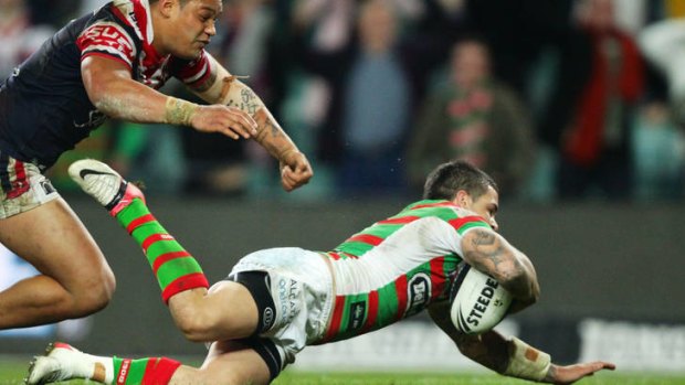 Adam Reynolds of the Rabbitohs dives over to score the match-winning try in the final seconds against the Sydney Roosters.