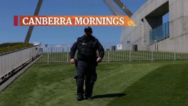 A security guard patrols the lawns at Parliament House. 