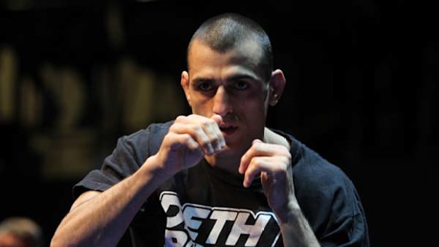 Shadow boxer . . . Australian UFC star George Sotiropoulos works out at Star City Casino yesterday.