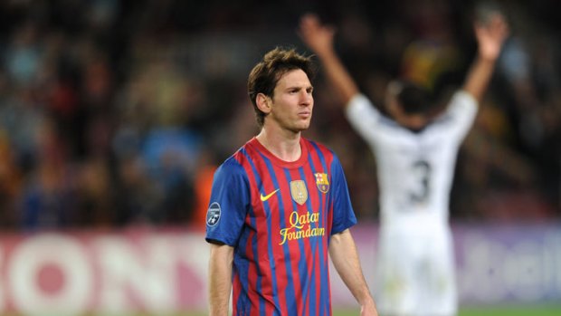 Defeated ... Barcelona's Argentinian forward Lionel Messi walks off the pitch.