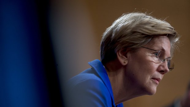 Senator Elizabeth Warren, a Democrat from Massachusetts, listens during a Senate Banking Subcommittee hearing with William C. Dudley, president and chief executive officer of the Federal Reserve Bank of New York, not pictured, in Washington, D.C., U.S., on Friday, Nov. 21, 2014. Dudley said in testimony he vowed to improve bank supervision and regulation, saying he's aware of the risk of becoming too cozy with large financial firms. Photographer: Andrew Harrer/Bloomberg *** Local Caption *** Elizabeth Warren