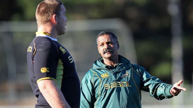 Peter De Villiers talks Springboks captain John Smit at training yesterday.