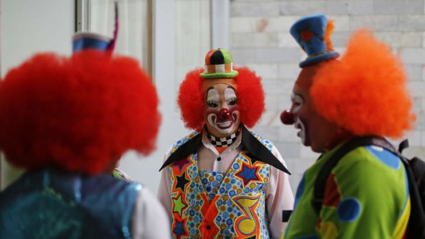 Clowns chat after registering to attend the 17th International Clown Convention in Mexico City.