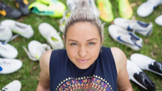 Matildas star Kyah Simon and some of her soccer boots collected over the years.