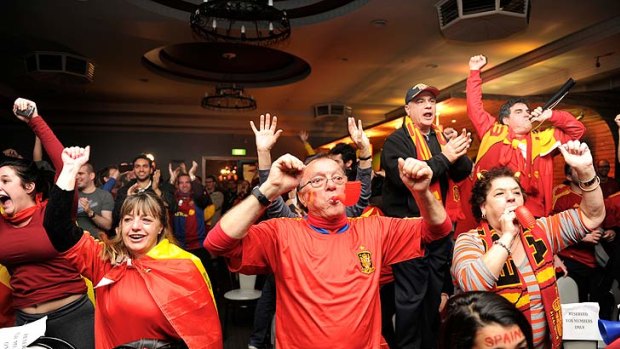 Soccer fans cheer Spain to victory at the Spanish Club in Fitzroy.