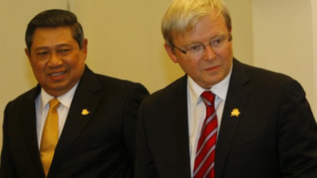 Staying home...Dr Yudhoyono meets Mr Rudd at APEC.