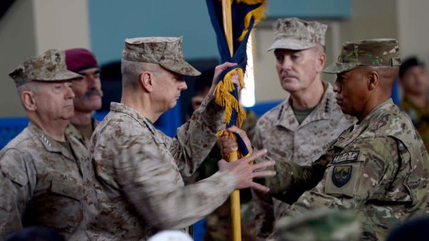 Departure ... Former NATO commander US General John Allen (third left) hands over a flag to US General Joseph F. Dunford (second right) as he takes over as commander in Kabul.