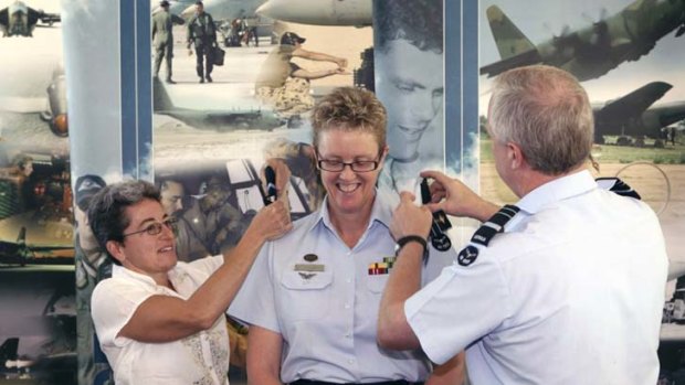 High flyer &#8230; Tracy Smart, the military's highest ranked lesbian, and her partner, Lisa, with the then chief of the air force when Tracy was promoted to air commodore in 2009.