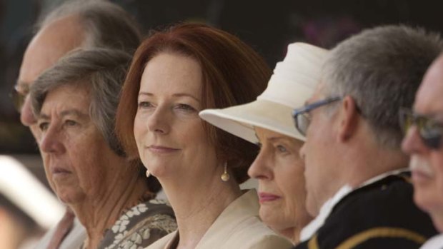 Holding out &#8230; Julia Gillard sits beside the Governor-General, Quentin Bryce, at the 70th anniversary of Japan's attack on Darwin. Photo: Glenn Campbell
