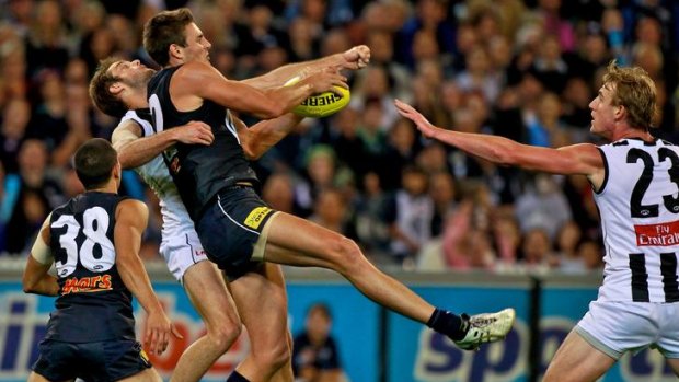 Blues ruckman Shaun Hampson takes a strong mark in front of Magpies defender Alan Toovey.