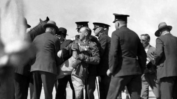 From the archives ... Francis de Groot is arrested on Sydney Harbour Bridge after interrupting NSW premier Jack Lang during the opening ceremony on May 19, 1932.