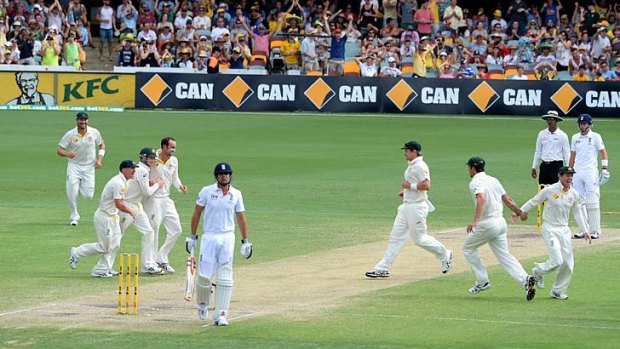 Captain cooked: Alastair Cook departs after a hard-fought 65, falling to a Nathan Lyon top-spinner after tea at the Gabba.