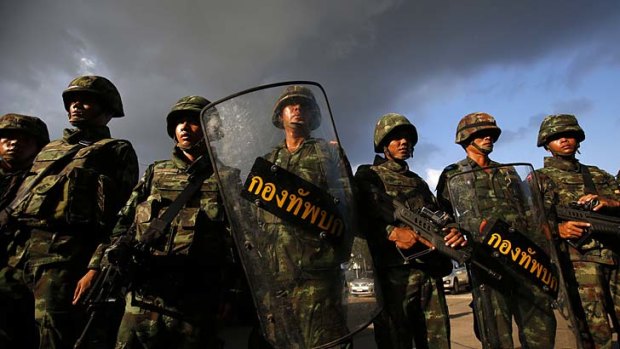 Soldiers stand guard during a coup at the Army Club where Thailand's army chief held a meeting with all rival factions in Bangkok.