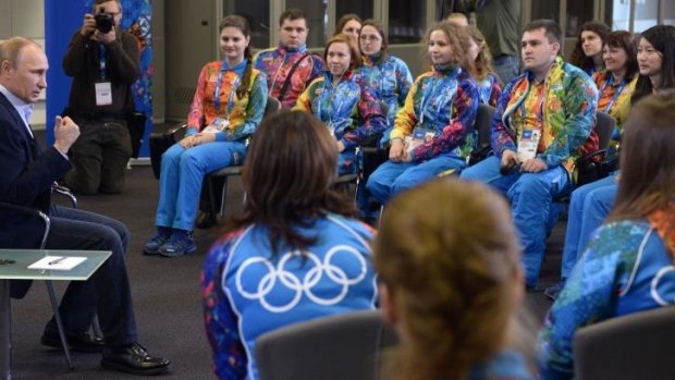 Russian President Vladimir Putin speaks to Olympic volunteers in Sochi, Russia.