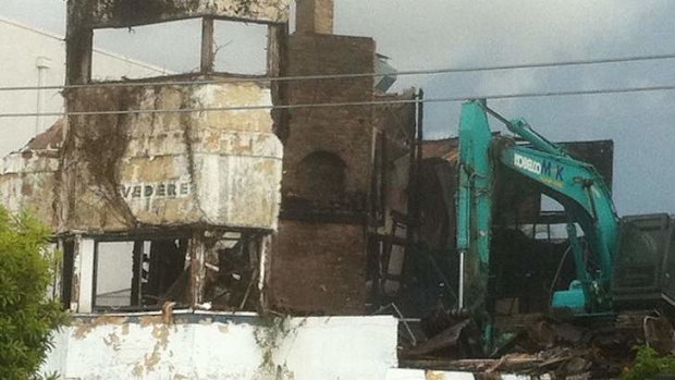 The Belvedere at South Brisbane is demolished after an early morning fire.