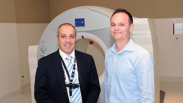 Doctor Sandro Porceddu and Paul Hunter with the new $4 million PET-CT scanner at Princess Alexandra Hospital.
