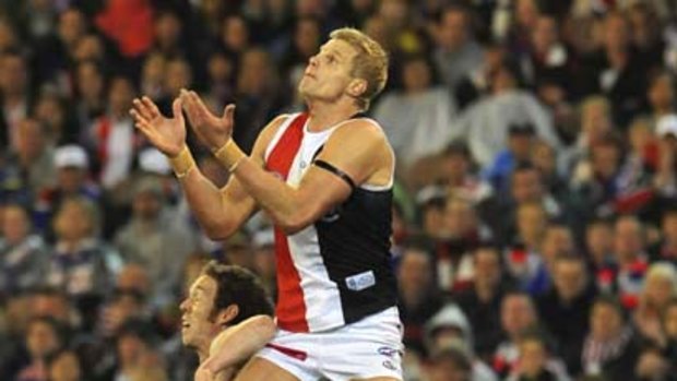 St Kilda skipper Nick Riewoldt soars over Robert Murphy on the way to leading his side to a grand final berth against Collingwood.