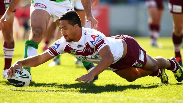 Faultless: Manly fullback Peta Hiku dives over for one of his side's six tries on Sunday.