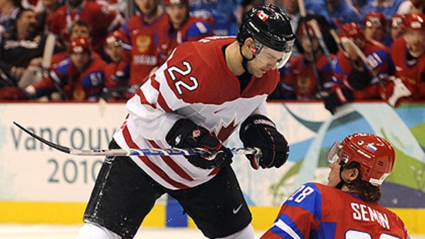 Canada's Dan Boyle looks down at Russian forward Alexander Semin in their quarter-final yesterday.