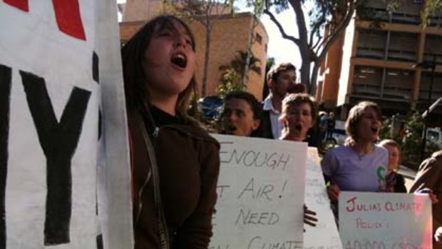 Protestors at Julia Gillard's climate change announcement in Brisbane today.