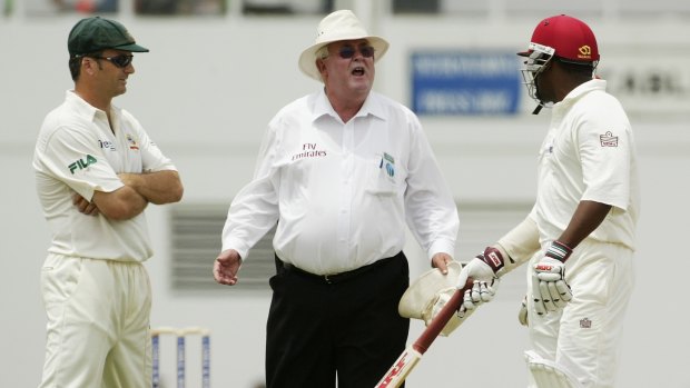 Umpire David Shepherd comes between Steve Waugh and Brian Lara in 2003.