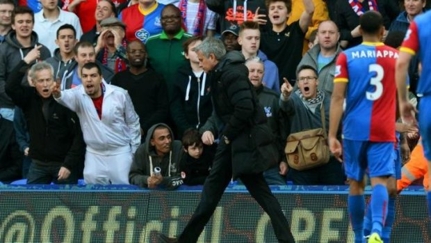 Mourinho is heckled by Palace fans.