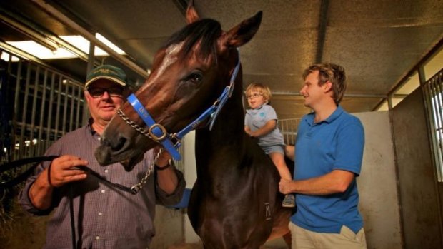 Family affair: Murray Baker, left, with son Bjorn, grandson Sven and It's A Dundeel.  The Kiwi trainer will be looking to the next generation on the track in the wake of It's A Dundeel's retirement.