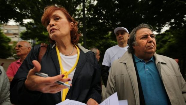 Irem Kutluk (left), the wife of detained Turkish admiral Ali Deniz Kutluk, demands justice for her husband and other officers imprisoned over the "Sledgehammer" plot in Besiktas Square, Istanbul, on May 31.