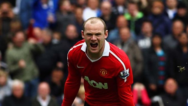 Rooney celebrates after scoring.