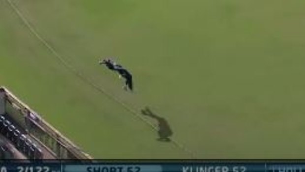 Glenn Maxwell brings the ball back from over the rope - and throws it to teammate Rob Quiney.
