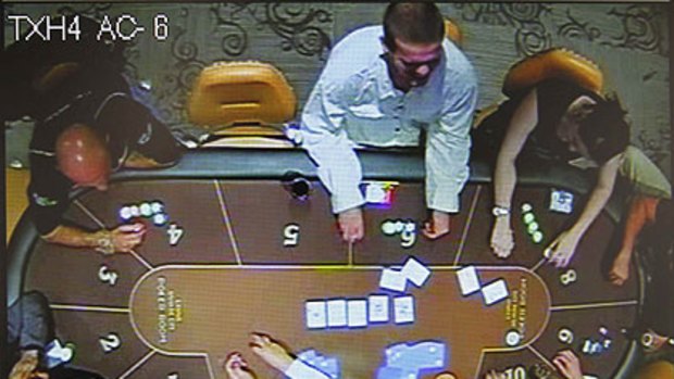 A video grab shows Joran Van der Sloot (top 2nd right) and  Stephany Flores playing at a casino before her murder on May 30.