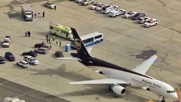 Suspicious packages... law enforcement officers surround the cargo plane at Newark airport.