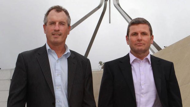Journalists Steve Lewis and Chris Uhlmann in front of Parliament House.