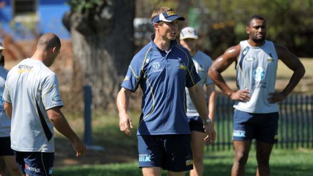 Team focus ... Stephen Larkham drills the Brumbies back line as preparations come to a head for their Super Rugby opener against Quade Cooper and the Queensland Reds.