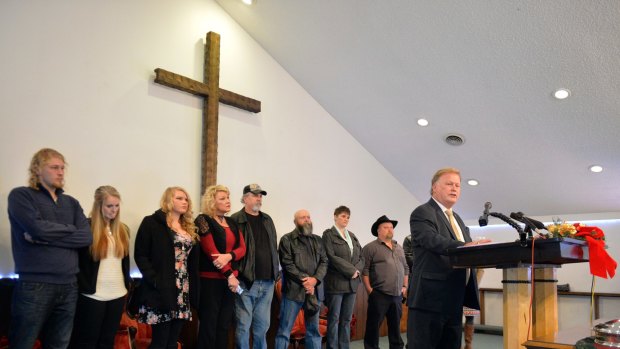 With friends and family standing behind him, Dan Johnson addressed the public from his church on Tuesday.