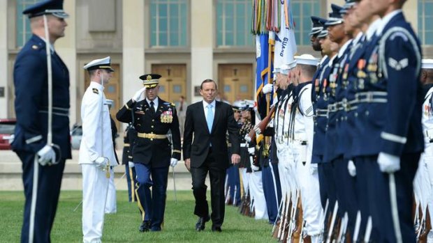 Prime Minister Tony Abbott receives full honours on his arrival at the Pentagon to meet Secretary of Defence Chuck Hagel