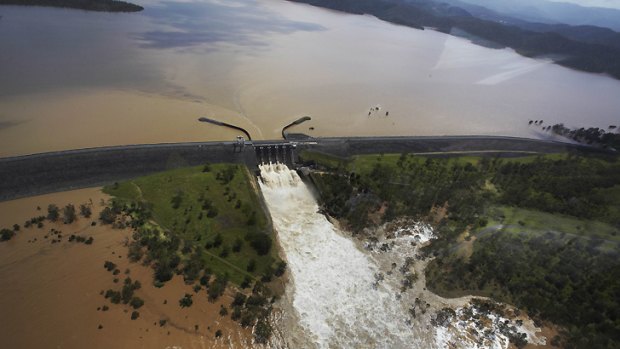 Water flows out of Wivenhoe Dam during January's flood.
