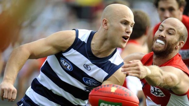 Geelong's Gary Ablett evading Sydney's Jarrad McVeigh in a best-on-ground performance in Geelong?s demolition of the Swans yesterday.