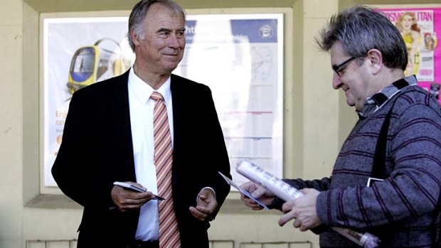 John Alexander hands out campaign leaflets at Eastwood.