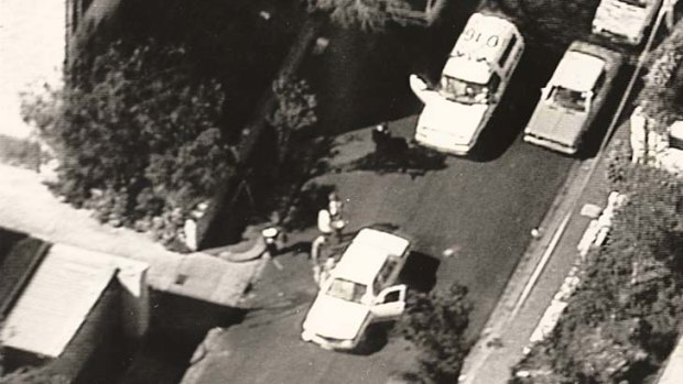 Ambush: Officers at the scene in Walsh Street, South Yarra, where policemen Damian Eyre and Steven Tynan were killed on October 12, 1988.